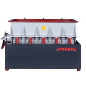 Front view of a large Vibratory Trough Machine used for surface finishing