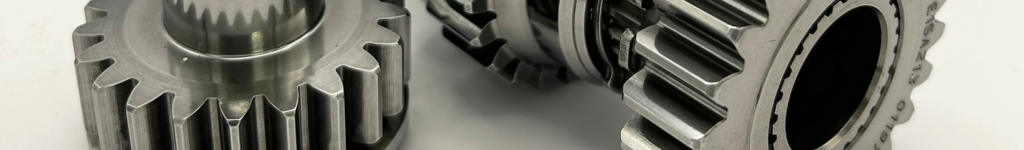 Close-up of two super finished, shiny gear components showcasing smooth surfaces.