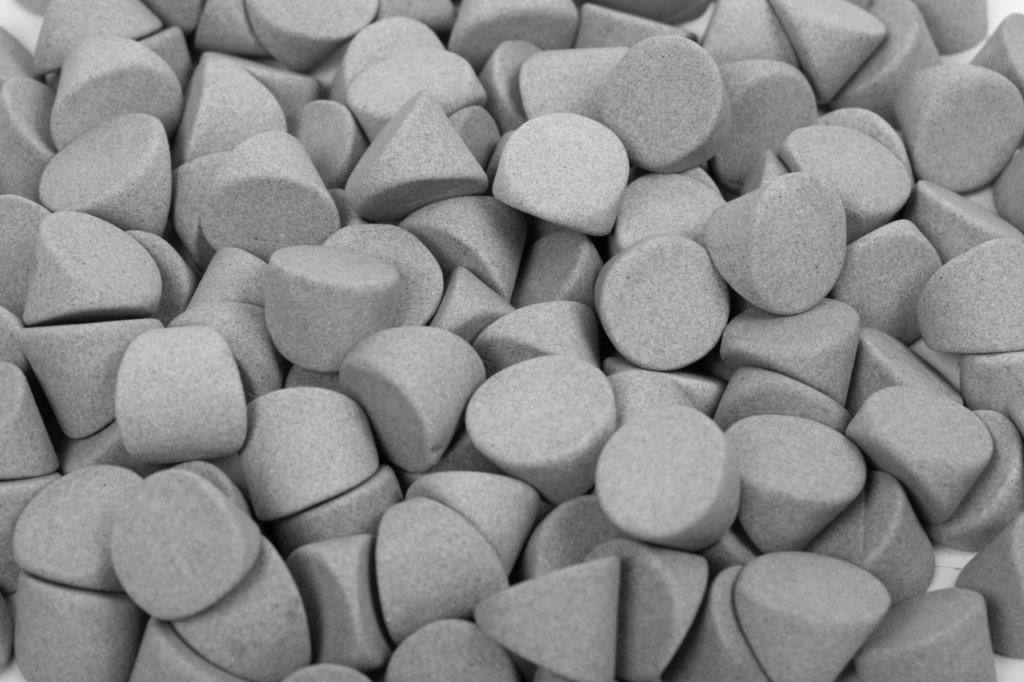 Ceramic wedge-shaped media for deburring, edge radiusing, and surface finishing applications.