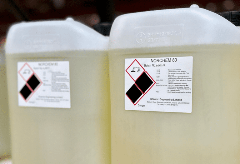 Close-Up of Norchem 80 Liquid Compound Container Close-up shot of a full container of Norchem 80 liquid compound, showing the product label and container details.