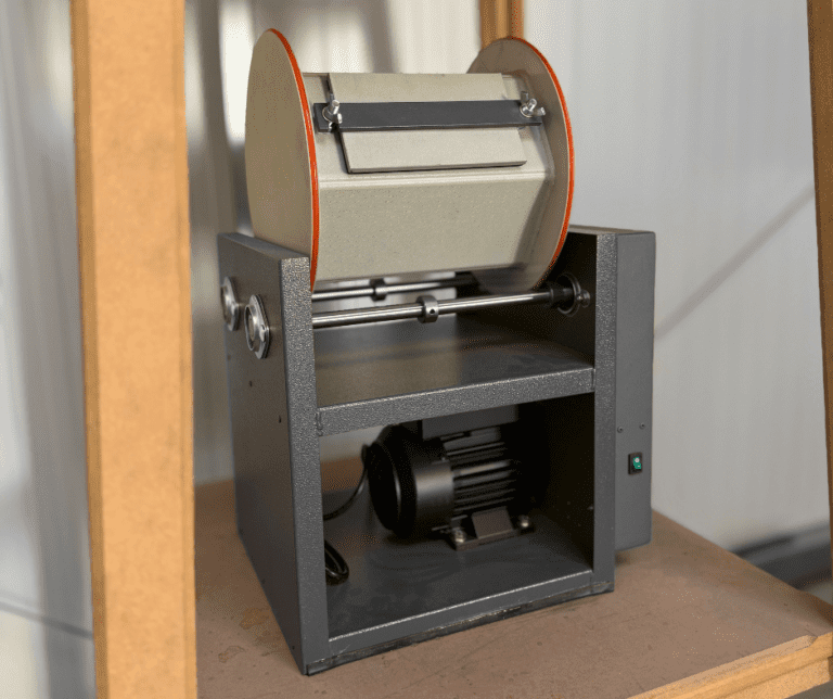 RotaSeries rotary barrel machine placed on storage shelf, compact design for precision finishing