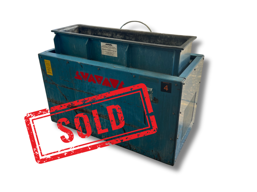 SOLD Used VB125 blue vibratory trough machine front view with visible lining and Sharmic logo